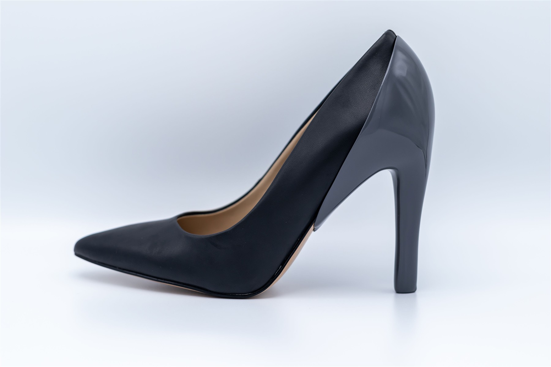 Dark matte heel cover shown on a black slim high heel